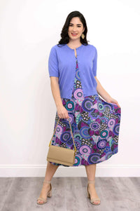 Model styling Evangelina tank dress with a blue cardigan and beige bag