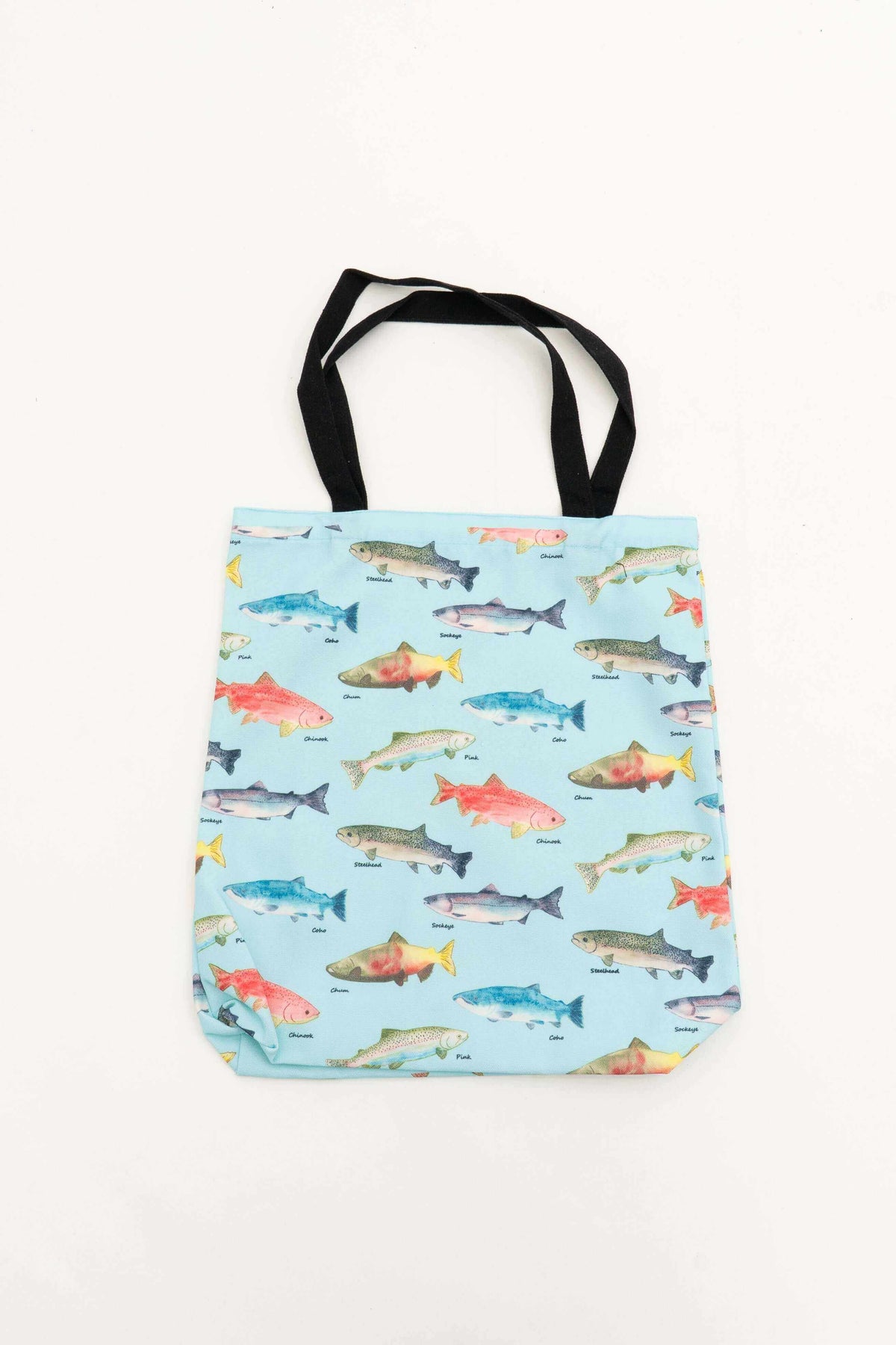 Reusable cotton tote bag with colorful fish print and black handles