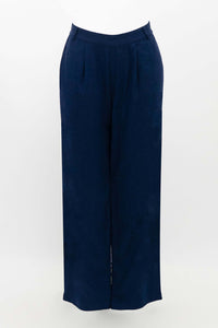 Flat lay of navy Melodie pants against a white background