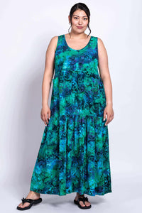 Woman modeling flowy blue-green maxi dress with relaxed fit, front view