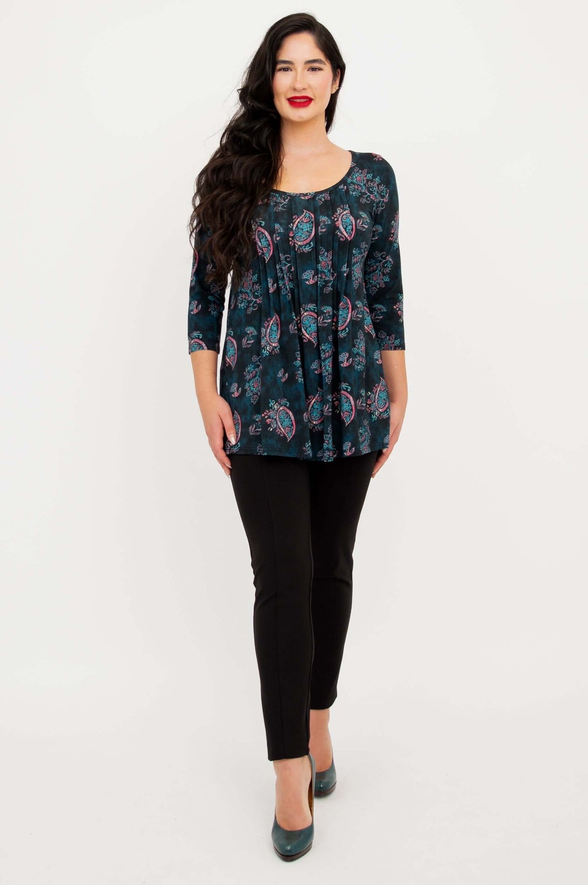 Front-facing view of model wearing Peyton Top in teal paisley showing length and shape