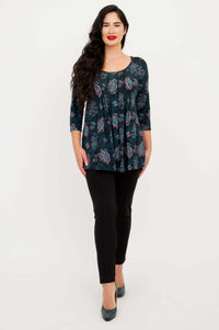 Front-facing view of model wearing Peyton Top in teal paisley showing length and shape