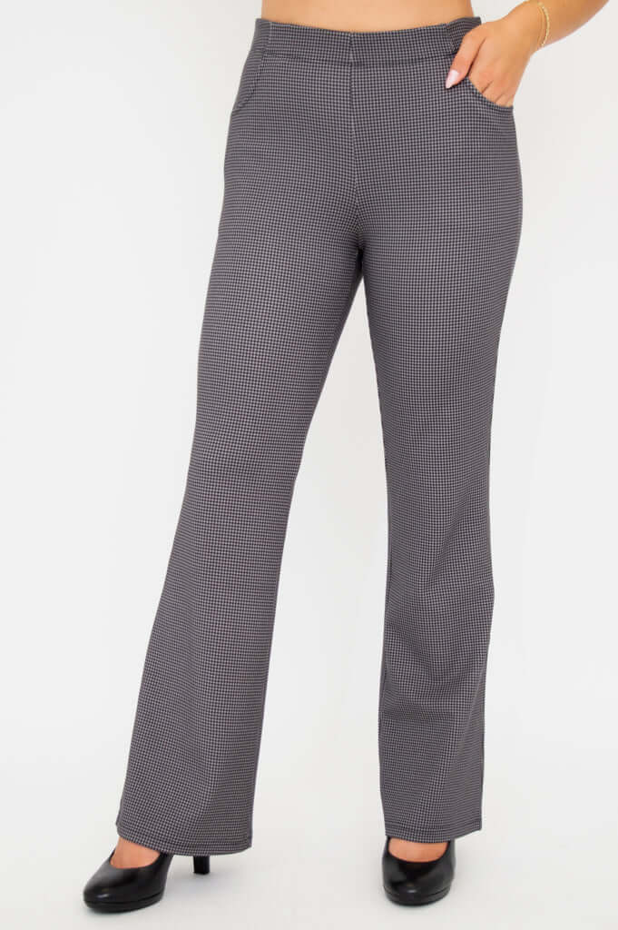 Front angled view of Sasha bootcut pants showing pocket detail