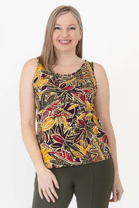 Woman wearing a sleeveless tank top with vibrant marigold batik pattern, close up front view