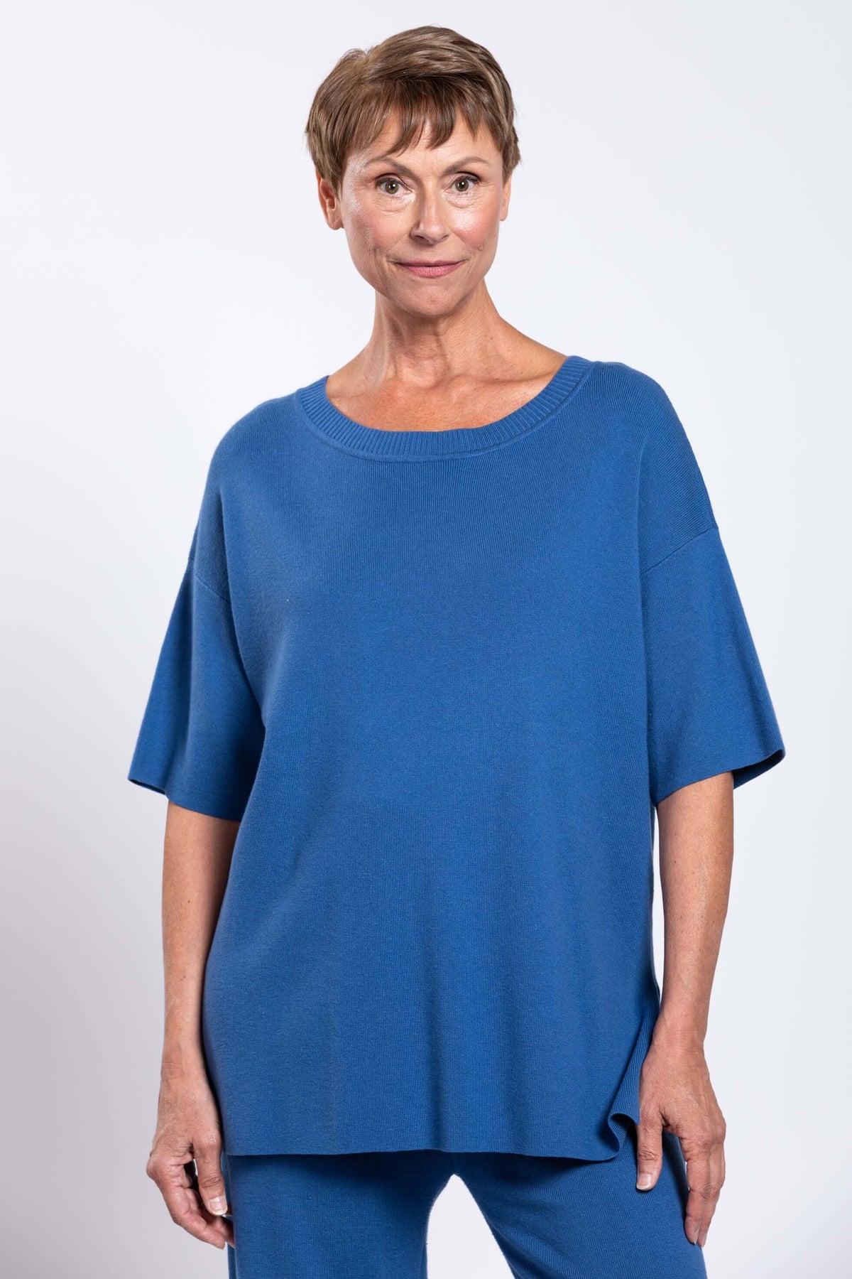 Front close-up of model in blue Sweater showing neckline and fit