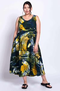 Model with hand in pocket, showcasing art print and maxi length of the Sara summer dress