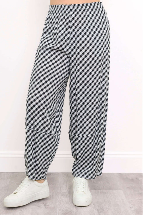 Close-up view of black and white gingham Boardwalk Pants front details