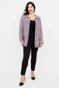 Model in Chanel Cardigan fully buttoned, hands by side, front view with black pants