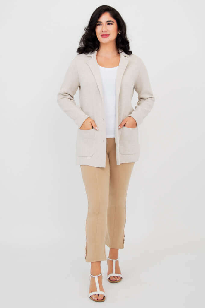 Full front view of woman modeling the Margaret beige cotton cardigan with pockets