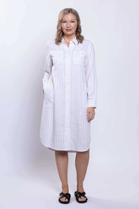 Model facing forward, hands in pockets, wearing viscose linen duster dress