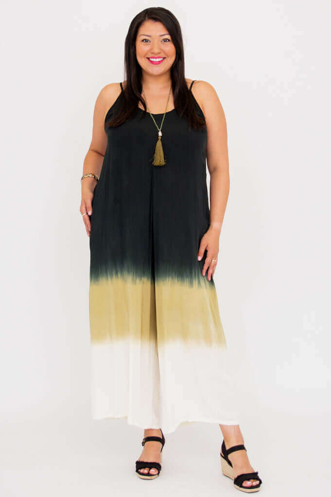 Woman modeling an ombre wide-leg jumpsuit with wedge sandals, front pose