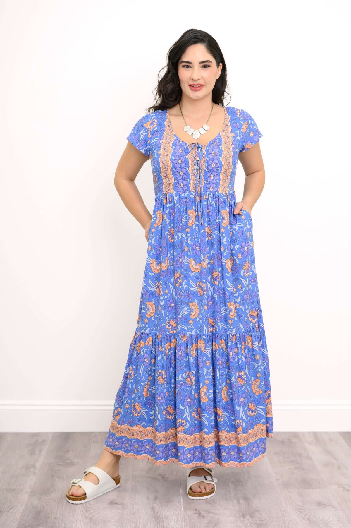 Blue floral boho maxi dress with pockets, front pose