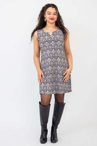 Front straight view of model wearing black and white bamboo shift dress with subtle vintage details