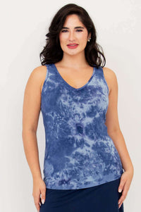 Front view of model wearing indigo tie dye reversible bamboo tank with V-neck