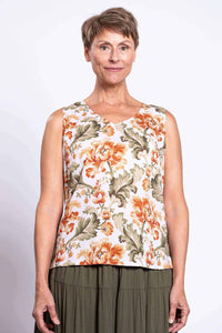 Front view of woman wearing a sleeveless floral V-neck tank top with wide straps