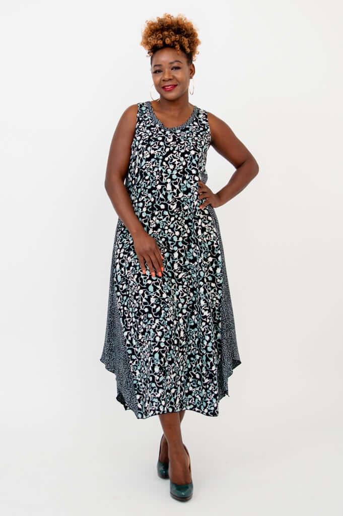 Front view of model wearing a sleeveless black and blue patterned tank dress