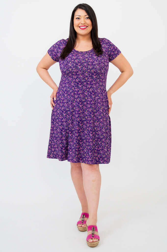 Front view of model wearing Callie Bamboo Dress in Violet Blossom print