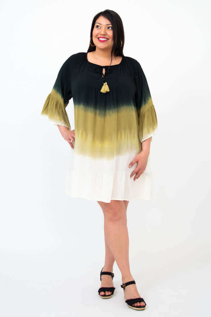 Front view of a woman wearing the Ellie Dress with ombre black, olive, and white colors