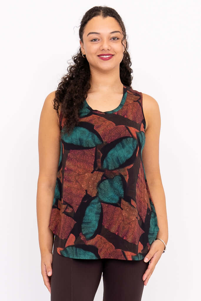 Front view of model wearing sleeveless Jazz tank with autumn leaf print