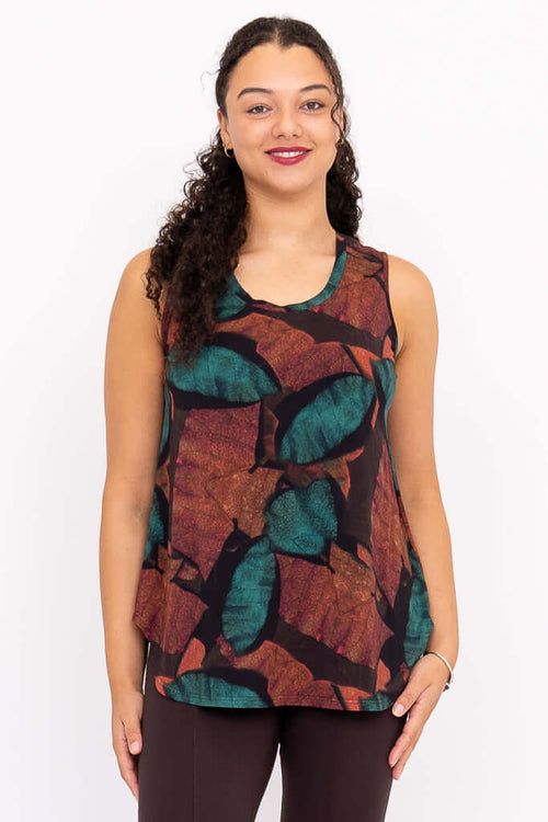 Front view of model wearing sleeveless Jazz tank with autumn leaf print