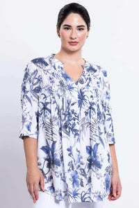 Front view of woman wearing Margate blouse with blue and white floral pattern