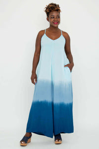 Front view of model wearing a blue ombre wide-leg jumpsuit with spaghetti straps