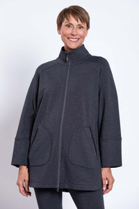 Woman in charcoal grey jacket with high collar zipped up, front view