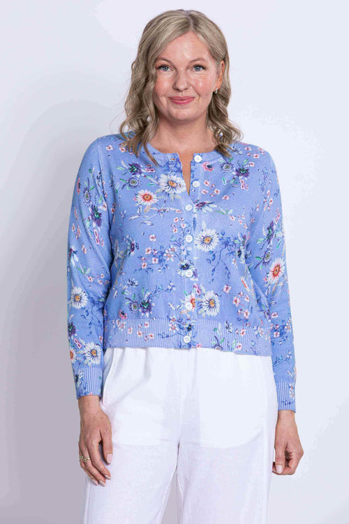 Front view close-up of a woman wearing a blue floral cotton cardigan
