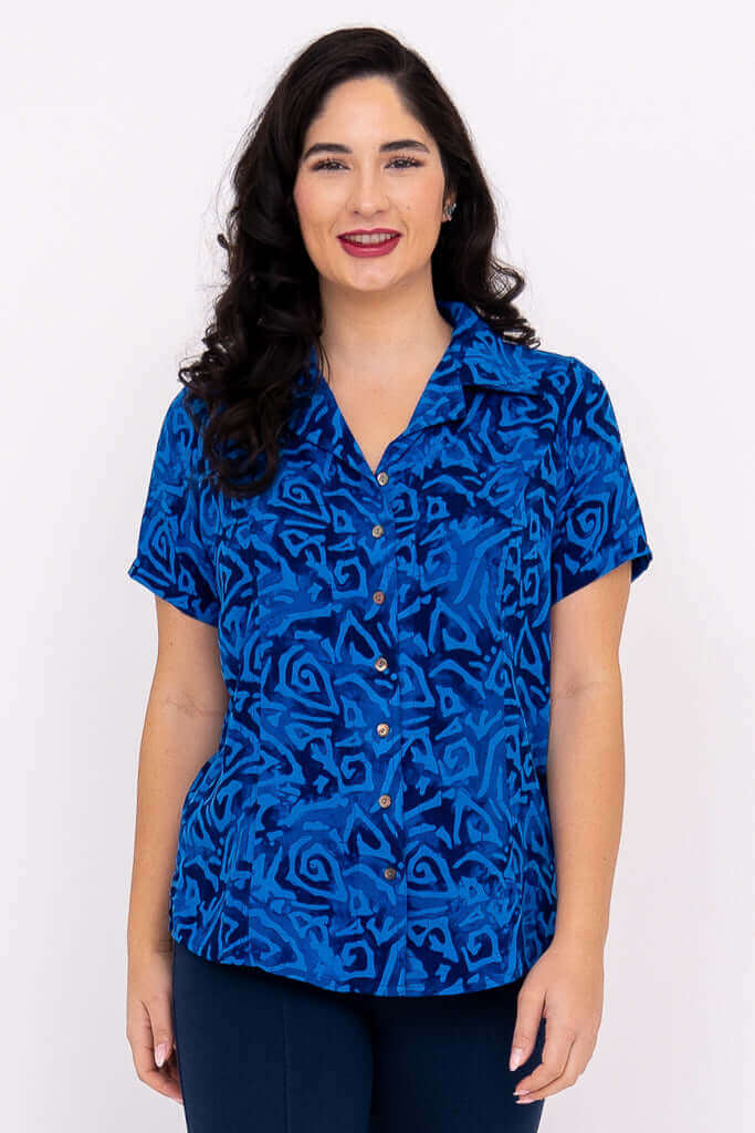 Front view of woman wearing Aida Top in blue abstract print