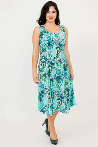 Front view of a woman wearing a sleeveless aqua floral A-line dress
