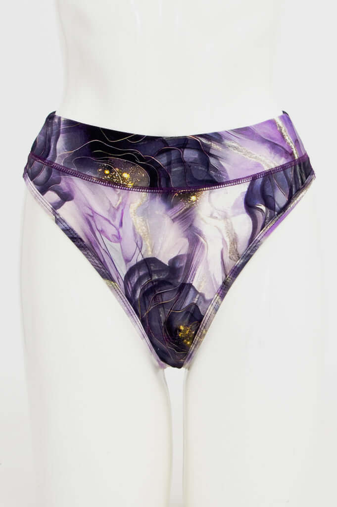 Front view of high-rise thong underwear in purple and gold abstract print on mannequin