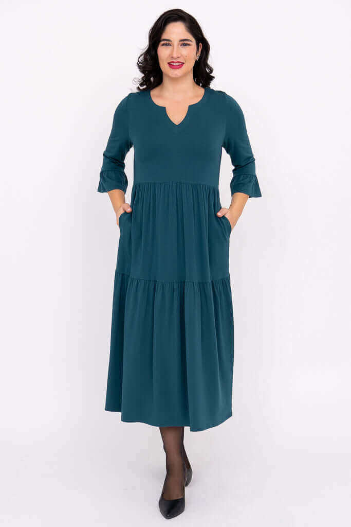 Front view of model in teal Bernadette Long Dress with pockets
