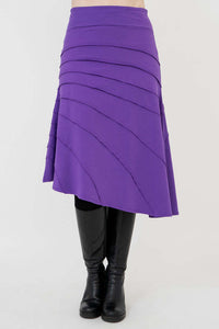 Front view of the Beverly Skirt in purple with asymmetrical raw edge details