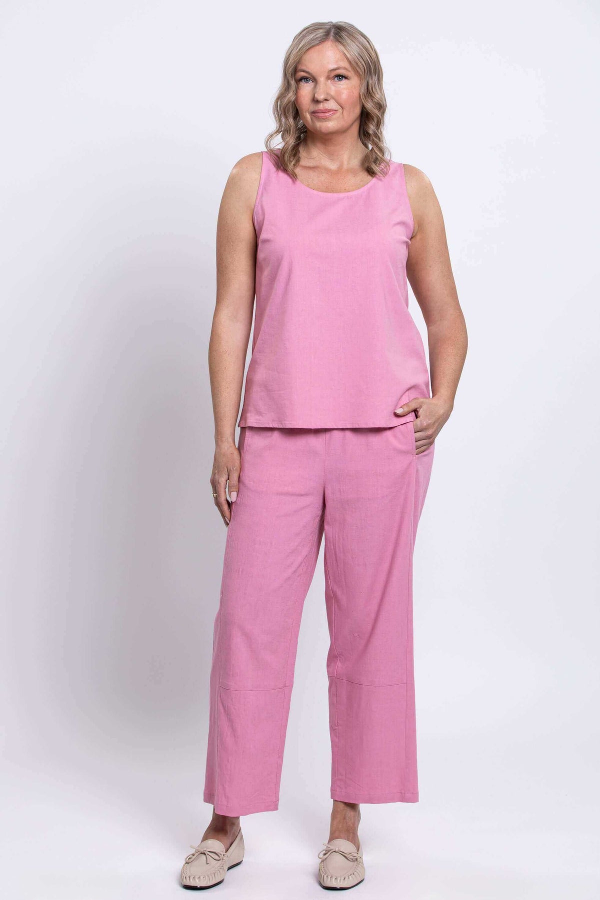 Front view of model wearing Boardwalk Pants in pink linen-blend and matching sleeveless top