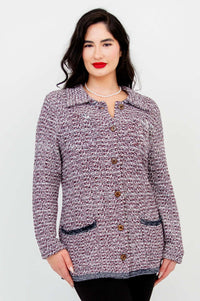 Front view of model wearing multicolour knit Chanel Cardigan with pearl necklace