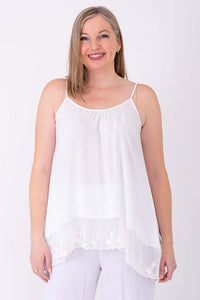 Front view of model wearing a white Chantilly Lace Tank with lace hem