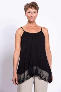 Front view of a woman wearing a black tank top with lace hem and spaghetti straps