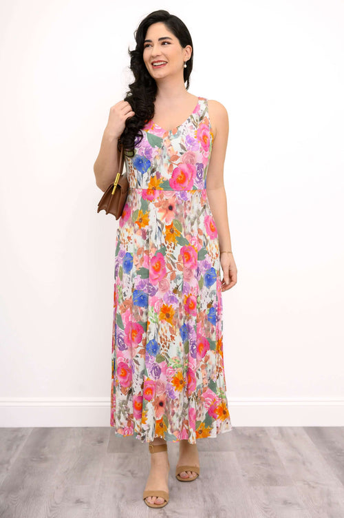 Front view of a woman wearing a vibrant floral sleeveless midi dress