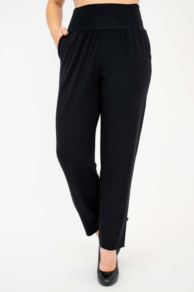 Front view of Clair bamboo pants in black with wide waistband and tapered leg