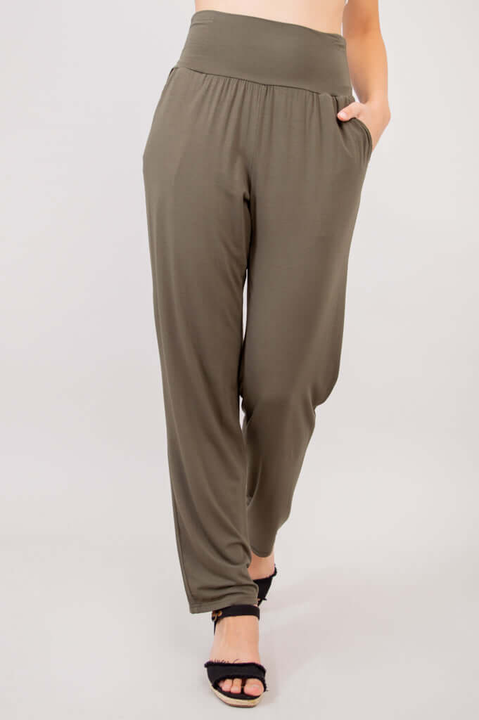 Front view of Clair bamboo pants with wide waistband and pockets, model standing