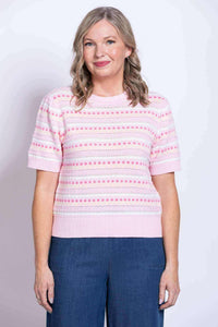 Front view of woman wearing Danny Sweater in light pink with dot stripes