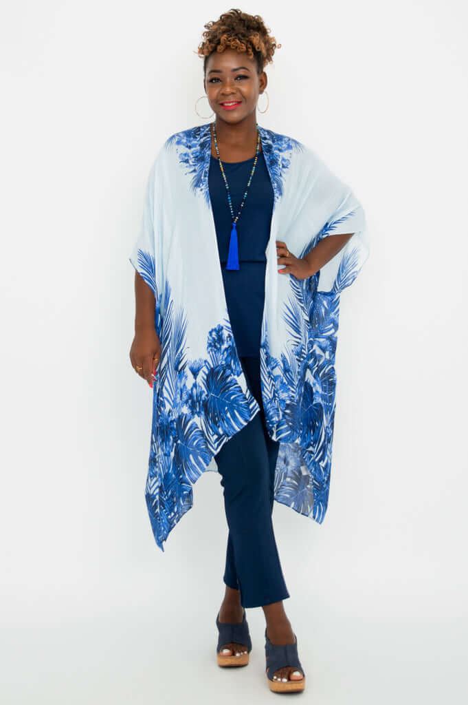 Front view of woman wearing light blue and dark blue palm print Darcy kimono wrap
