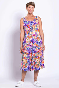 Front view of woman wearing a vibrant floral A-line tank dress