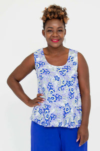 Front view of model wearing a blue paisley sleeveless Ginny Peplum Tank top
