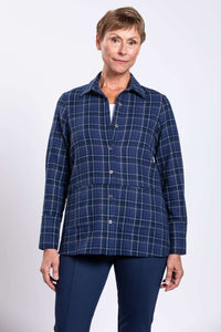Front view of a woman wearing a blue plaid cotton jacket with button closure