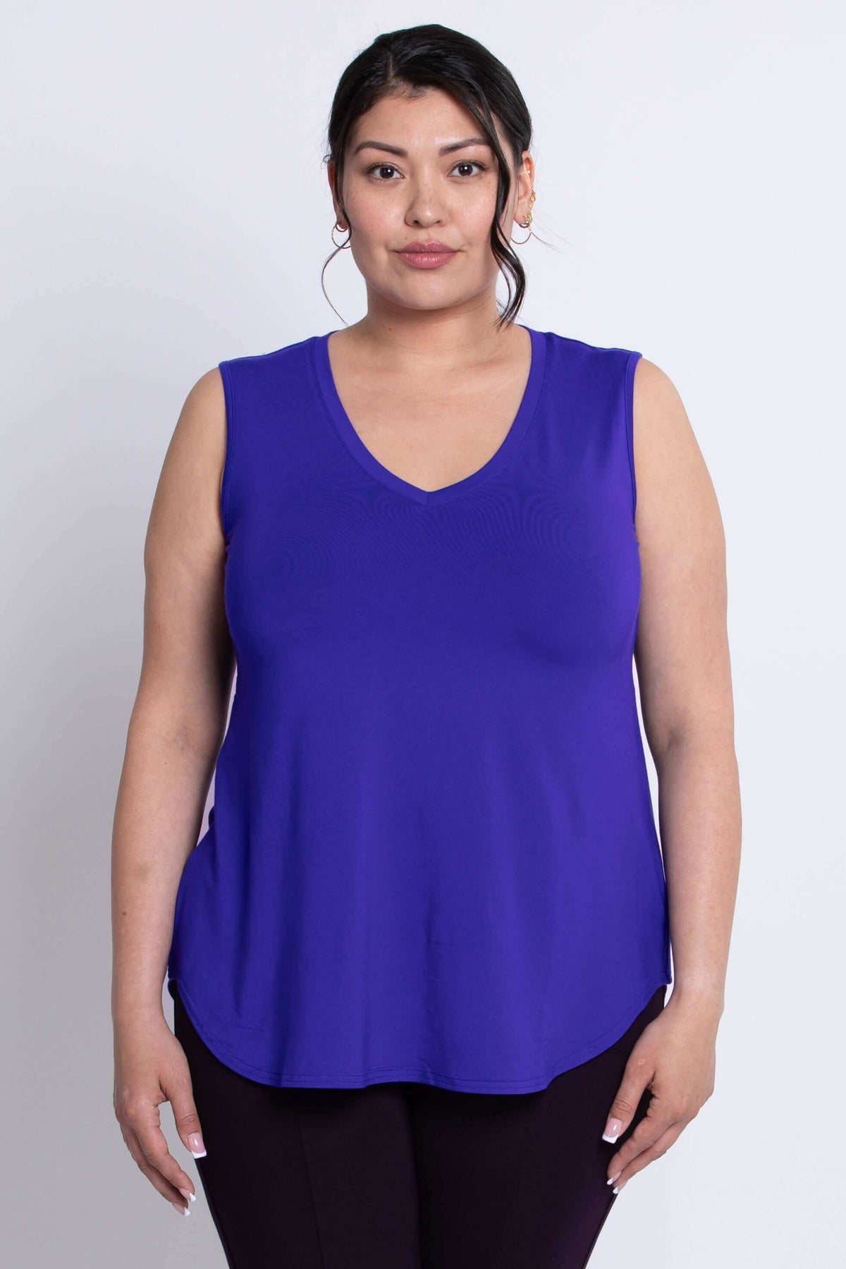 Front view of model wearing Jackie bamboo sleeveless top in vibrant blue