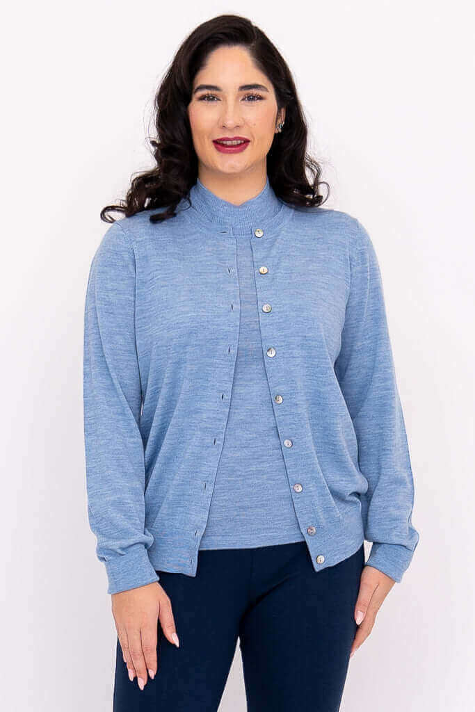 Front view of woman wearing a light blue Merino wool button-up cardigan