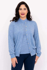 Front view of woman wearing a light blue Merino wool button-up cardigan