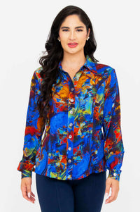 Front view of woman wearing a vibrant Linzy bamboo and linen blouse with colorful print