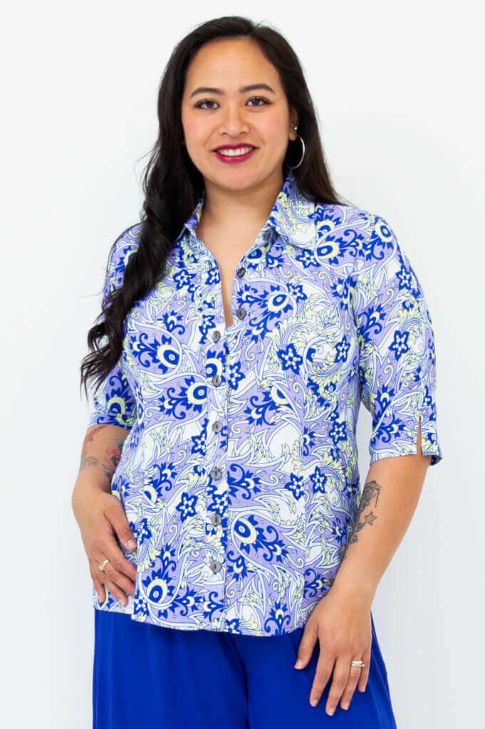 Front view of model wearing tailored blue paisley bamboo linen blouse with elbow-length sleeves